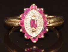 A 9ct gold ring set with a marquise cut ruby, diamonds and a border of round cut rubies, 3.7g,