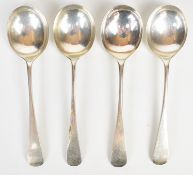 Four Old English pattern hallmarked silver soup spoons, various dates and makers, three being