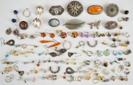 Nine silver brooches including pressed amber, filigree, dog, etc (86g) and fifty-two pairs of silver