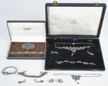 A suite of silver jewellery set with marcasite comprising necklace, bracelet and earrings in