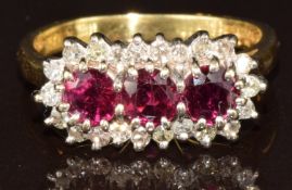 An 18ct gold ring set with three round cut rubies, each approximately 0.35ct, surrounded by