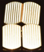 A pair of 18ct gold cufflinks with white enamel decoration, 17.1g