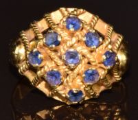 An 18k gold ring set wit sapphires in a rope twist lattice setting, 5g, size N