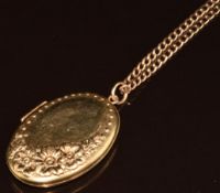 A 9ct gold locket with embossed floral decoration (4 x 2.7cm) on 9ct chain, 11.9g, 62cm