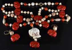 Neiger Art Deco glass necklace made up of figural red elephant shaped beads, round white beads and a