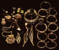 Seven pairs of 9ct gold earrings (3.4g), eleven single 9ct gold earrings (6.2g), an 18ct gold single
