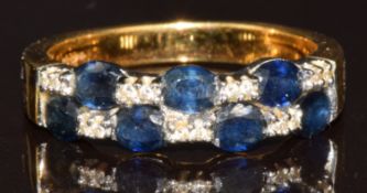 An 18ct gold ring set with seven oval cut sapphires and fourteen round cut diamonds, 5g, size N