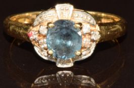 An 18k gold ring set with an oval cut Russian Alexandrite of approximately 0.5ct and diamonds,