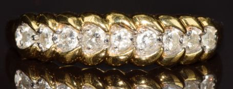 An 18ct gold ring set with diamonds totalling approximately 0.25ct, 2.8g, size M/N