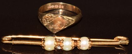 A 9ct gold heart shaped signet ring (2g, size L) and a yellow metal brooch set with three pearls (