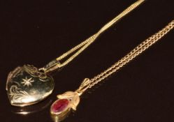 A 9ct gold locket set with a diamond, two 9ct gold chains (40cm), and a rolled gold pendant, 4.8g