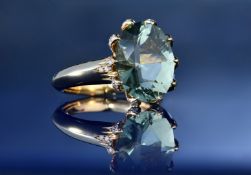 Kat Florence 18k gold ring set with an oval cut Paraiba tourmaline of approximately 5.98ct and 126