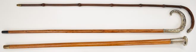Three silver mounted walking sticks including Malacca, dog and prey with feature hallmarks etc,