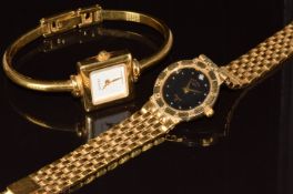 Two gold plated ladies wristwatches Gucci ref. 1900L with gold hands and square white dial, and