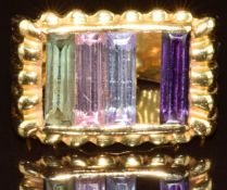 An 18ct gold ring set with cubic zirconia (one stone misising), 7.7g, size N