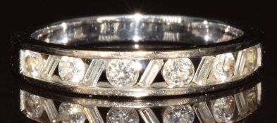 An 18k white gold half eternity ring set with alternating round and baguette cut diamonds, 4g,