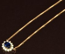 A 14ct gold necklace set with a sapphire surrounded by diamonds, 2.9g, 40cm