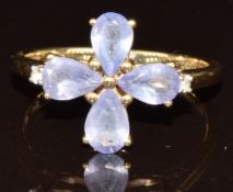 A 9ct gold ring set with four pear cut tanzanites and a zircon, with certificate, 2g, size N