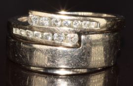 An 18ct gold ring set with diamonds, with matching 18ct gold band made to be worn with it, 8.8g,