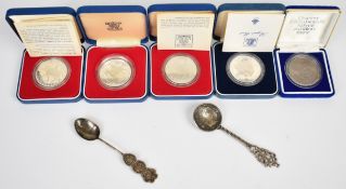 Three cased Royal Mint silver proof Silver Jubilee crowns and a similar 1981 Royal Wedding silver