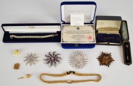 Edwardian 15ct gold stick pin set with a ruby and diamonds, a conch shell charm set with a