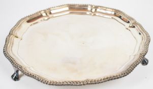 Elkington silver plated salver with gadrooned edge, raised on three feet, diameter 36cm