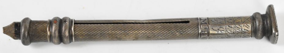 Georgian or Victorian silver pencil holder, the wrythen body having perpetual calendar rings and the