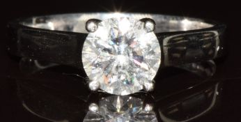 A platinum ring set with a round brilliant cut diamond of approximately 1ct, 4.5g, size M