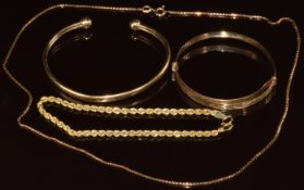 A 9ct gold torque bangle, 9ct gold christening bangle, 9ct rope twist bracelet and 9ct gold
