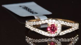 A 9k gold ring set with an oval cut Mahenge red spinel and white zircons, with Gemporia certificate,