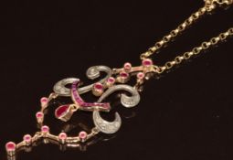 A 9ct gold pendant set with rose cut diamonds and pear cut, round cut and calibre cut rubies, 13.6g