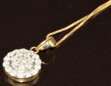 A 9k gold ring set with round cut diamonds in a cluster, total 0.5ct, on 9ct gold chain, with