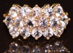 A 9k gold ring set with sixteen round cut Katlang imperial topaz of approximately 2.8ct, with