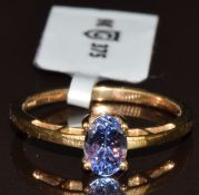 A 9k gold ring set with an oval cut AA tanzanite of approximately 0.6ct, with Gemporia certificate,