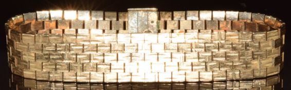 A 9ct gold bracelet made up of textured rectangular links, 41.7g, 18cm