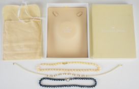 Three cultured pearl necklaces all with 14k gold clasps, one clasp set with a further pearl and
