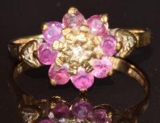A 9ct gold ring set with a diamonds and rubies in a cluster, 2g, size J
