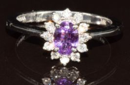 An 18k white gold ring set with an oval cut Madagascan purple sapphire of approximately 0.9ct