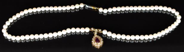 A single strand of cultured pearls with 18ct gold barrel clasp and 18k gold pendant set with a