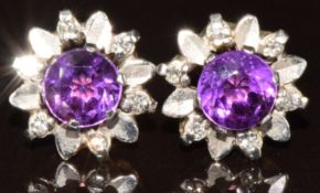 A pair of 9ct gold earrings set with round cut amethysts and diamonds in a floral setting, 2.6g