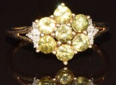 A 9k gold ring set with Ambanja demantoid garnets and diamonds in a cluster, limited edition 1 of 36