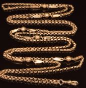A c1900 9ct rose gold guard chain made up of circular, elongated and spherical links, 22.3g, 148cm