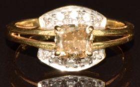 An 18k gold ring set with an antique brilliant cut Argyle champagne diamond of approximately 1ct and