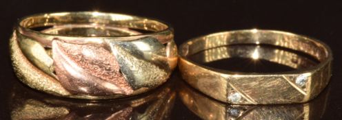 Two 9ct gold rings, one set with diamonds and the other with tri-coloured foliate decoration, 3.