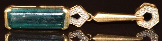 An 18k gold pendant set with an octagonal cut Pirineu tourmaline of approximately 9.3ct and eight