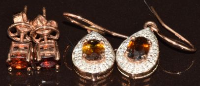 Two pairs of 9k rose gold earrings, one pair set with oval cut zircons and the other sphene and
