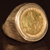 A 9ct gold ring set with a 1981 1/10 gold krugerrand, 7.5g, size J