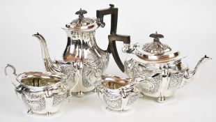 George V hallmarked silver four piece tea set comprising teapot, hot water jug, sugar bowl and