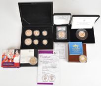 Cased silver coins comprising early issue maple leaf, six London Mint coins, five with certificates,