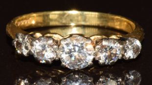 An 18ct gold ring set with five diamonds measuring approximately 0.4, 0.15, 0.15, 0.08 and 0.08ct,